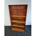 A Mid century teak bookcase produced by Minty Oxford. [142x76.5x28cm]