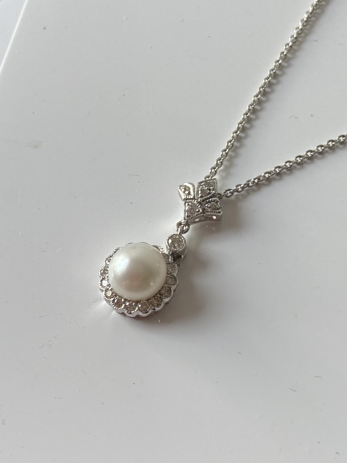 An 18ct white gold diamond cluster & single pearl pendant with an 18ct gold necklace [length - Image 6 of 6