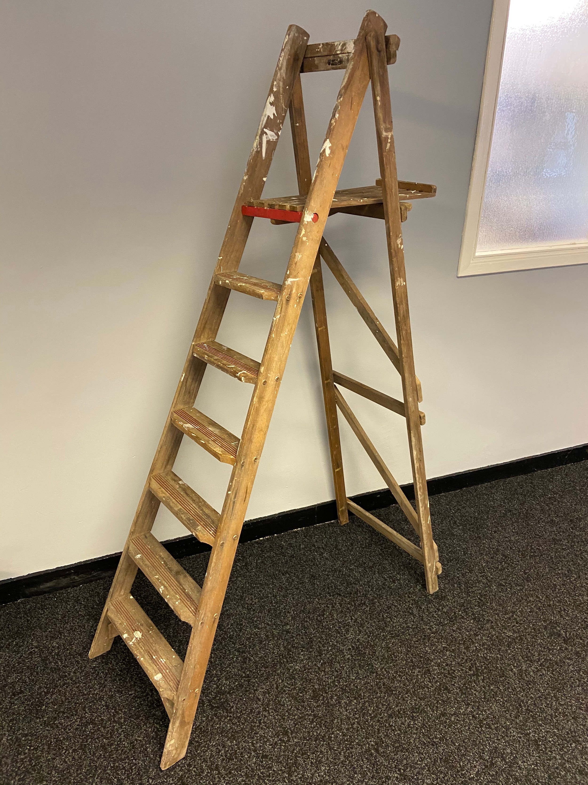 A vintage set of wooden A frame ladders