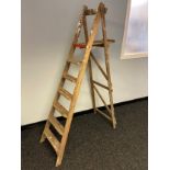 A vintage set of wooden A frame ladders