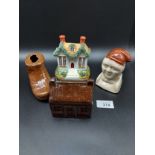 A Lot of various porcelain banks to include treacle glaze boot, house and bust. Also includes a