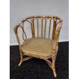 A Vintage wicker weaved childs/ doll's seat.