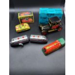 A Lot of four vintage tin plate vehicle models.
