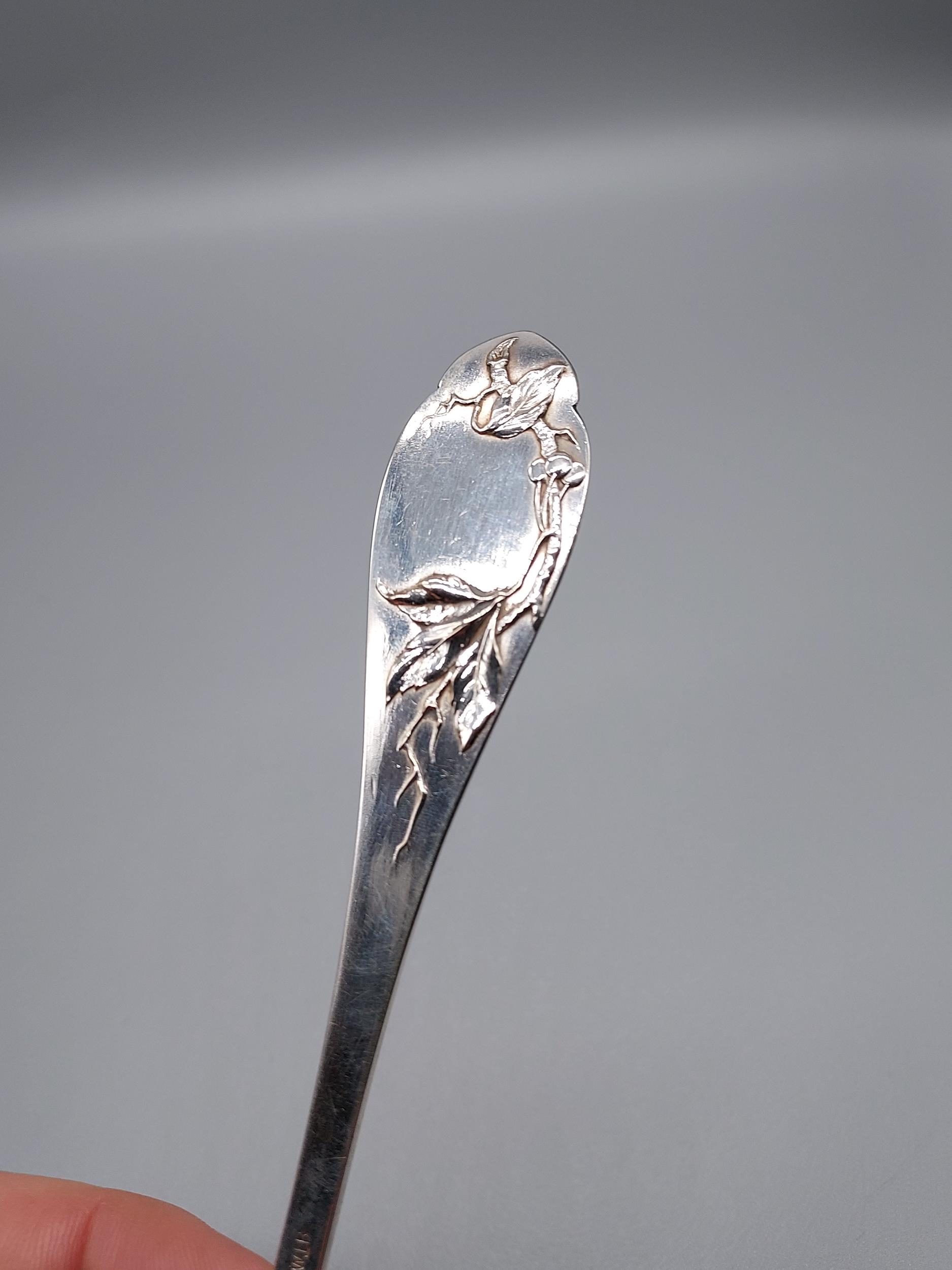 A German 800 Silver marked desert spoon, Designed with a raised relief bird eating berries. [19. - Image 3 of 4