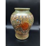 A Charlotte Rhead Bursley Ware Fruit and Floral tube line pattern vase. [24cm in height]