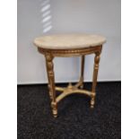 A Regency gold leaf base and marble top side table. Designed with carved trims. [61.5x50x38cm]