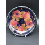 A Moorcroft Pomegranate Pattern plate/ bowl. [21cm in diameter] Impressed marking and signature to