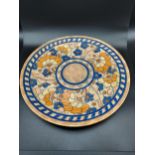 A Charlotte Rhead 'Byzantine pattern' Crown Ducal wall charger. [33cm in diameter]