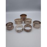 A Lot of 7 various silver hallmarked napkin rings. [264grams]