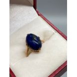 An Antique 9ct gold ring set with an oval Lapis Lazuli stone. [Ring size J][2.09grams]