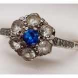 A Vintage 9ct & silver ladies ring set with a single blue stone surrounded by 6 clear stones. [
