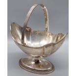 A London silver swing handle basket. Produced by Thomas Bradbury & Sons [139.25grams] [9x13x10cm not