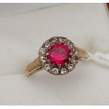 A Nice example of a ladies 9ct gold ring, with a large pink stone surrounded by clear stones. [