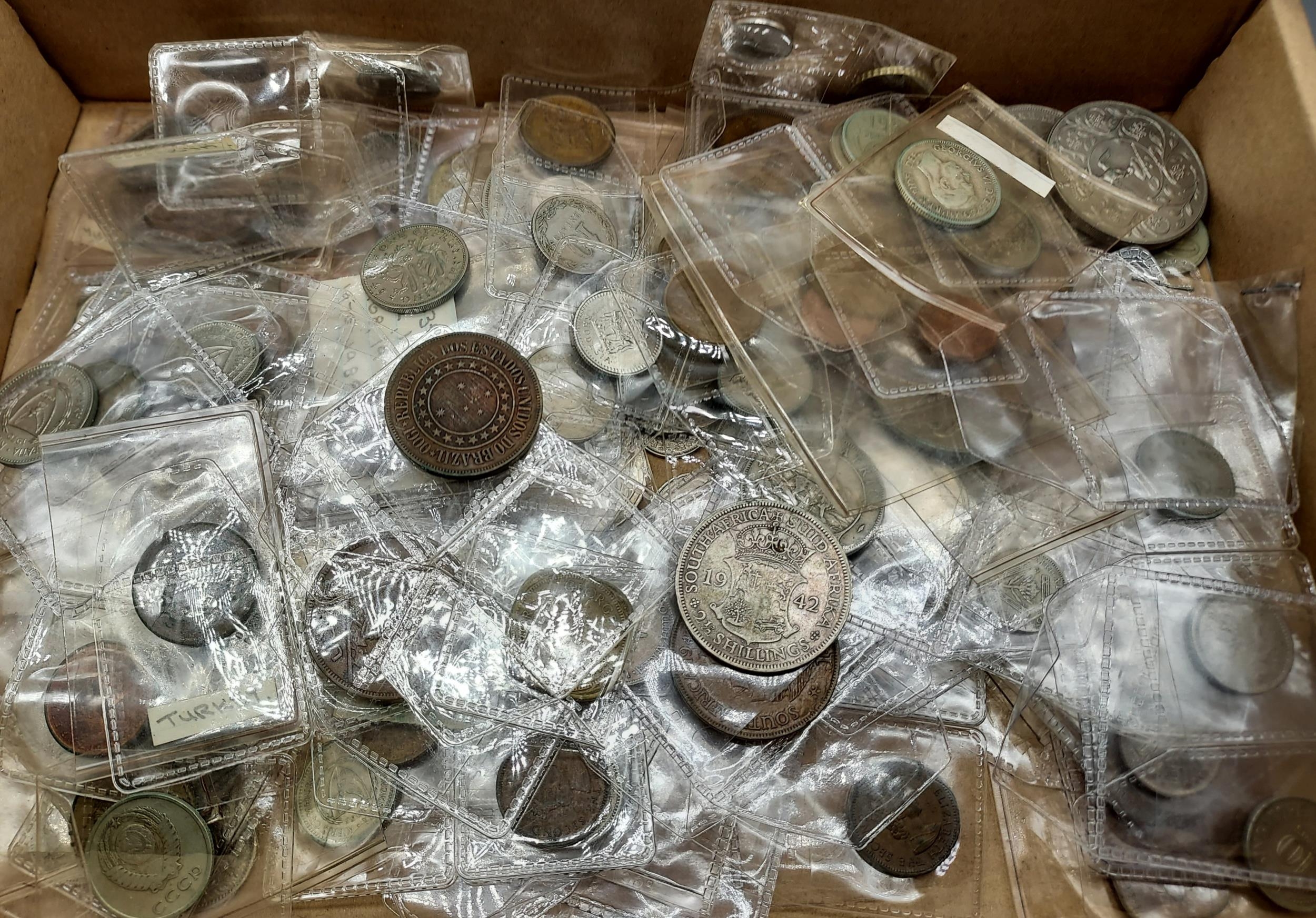A Box containing a quantity of antique and vintage coinage includes various silver coins and foreign