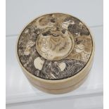 A Japanese Meiji period Ivory preserve pot, engraved with various wild animals to the lid area. [3.