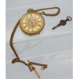 An Antique 18ct gold half hunter pocket watch with a gilt metal Albert Chain and T- Bar. Pocket