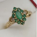 A 9ct gold, Emerald and diamond ladies ring. [Ring size P] [Weighs 2.59grams]