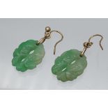 A Pair of Chinese hand carved jade and gold earrings.