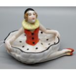 A Ceramic Art Deco figure in the form of a pin doll.