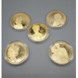A Lot of five Royalty gilt plated collectors coins all with protective casings.
