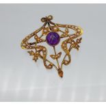 An Art Nouveau 15ct gold suffragette brooch/ pendant. Designed with seed pearls and a single