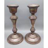 A Pair of Birmingham silver candle sticks. Produced by B & Co. Dated 1956. [20.5cm in height]
