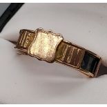 An 9ct gold Mourning Ring. 'In Memory Of' engraved. [Ring size P] [2.50Grams]