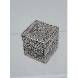 An Ornate silver cube design pill box. [2.8cm square]