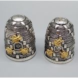 A Pair of unusual bee hive style condiment pots. Silver plated. [Stamped 800 to the underside] [