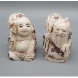 A Pair of Antique Japanese hand carved netsukes of figures. Signed to the base. [5cm in height]