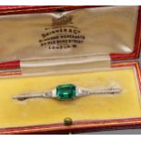 A Vintage 18ct and platinum diamond and green stone brooch. [4.72grams] Comes with original box.