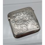 A Birmingham silver ornate vesta case. Engraved with initials P.M.B. [4x4cm]