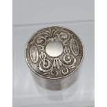 A Sheffield Sterling silver lidded pill box, Art Nouveau lid design detailing figures and spider web