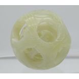 Antique Chinese hand carved jade puzzle ball sculpture. [5cm in diameter]