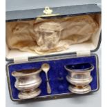 A Boxed Birmingham silver condiment set. Two pots and one spoon. Produced by A J Bailey. [0ne blue
