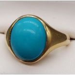 A London 18ct gold gents ring set with a large turquoise coloured stone. [Ring size N] [7.35Grams]