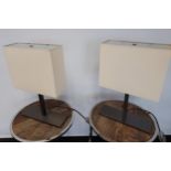 A Pair of stylish B&B Italia Maxalto Collection table lamps, touch motion pads in a working