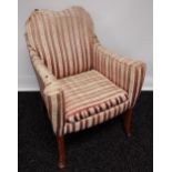 A Vintage bedroom arm chair.[Needs reupholstered]