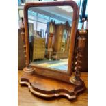 A 19th century table top mirror with barley twist supports. [65cm in height]