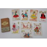 A Selection of Vintage Spanish souvenir postcards designed with needle worked clothes.