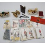 A Selection of vintage military postcards, Russian cap badges, flask and cut throat razor etc