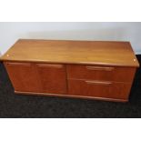 A Mid century low sideboard designed with two drawers and two door storage area. [55x135x46cm]