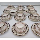 A 38 Piece Crescent China [A4145] Rose design tea set. Gilt and blue trim finishes.