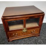 An Oriental swivel top entertainment unit. Designed with brass locks and handles. [61x70x49cm]