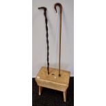 Antique pine milking stool together with two various walking canes.