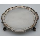 A London silver card Tray with a pie crust edge. Sat upon four feet. Produced by A Chick & Sons