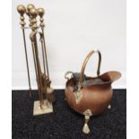 Antique copper and brass helmet coal scuttle together with a brass companion set.