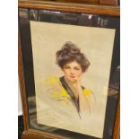An Art Nouveau design poster depicting a women posing. [Frame measures 50x37cm]