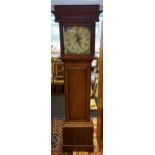 A Georgian longcase grandfather clock with a hand painted face. Comes with a pendulum and single