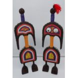 Two African Tribal figures designed with bead work and shells. [60cm in height] [1 as found]